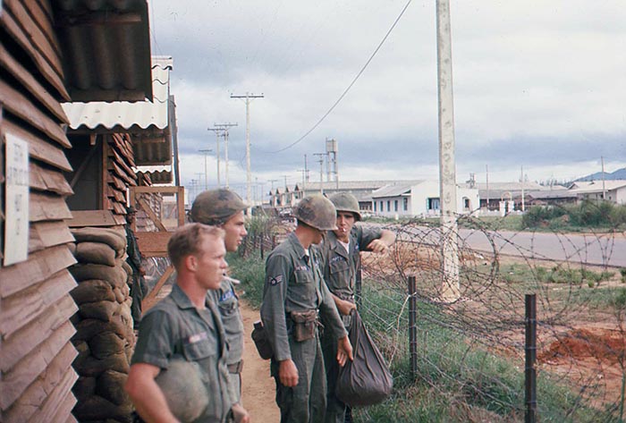13. Đà Nẵng AB, Tent City: Air Police do not wait for notice to report for duty, and stand ready for the first sign of actual attack. 1965.