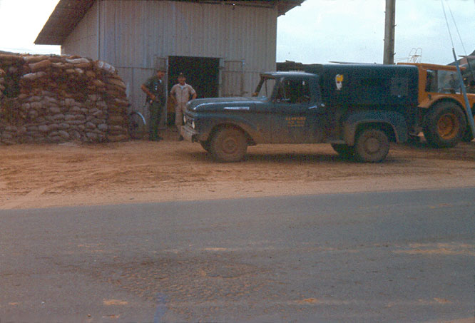 8. Đà Nẵng AB, Tent City: Close up of Pump Station with patched mortar crater in foreground. 1966.. Đà Nẵng AB, Tent City: Close up of Pump Station. 1966.