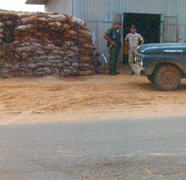 9. Đà Nẵng AB, Tent City: Closer view of Pump Station with patched mortar crater in foreground. 1966.