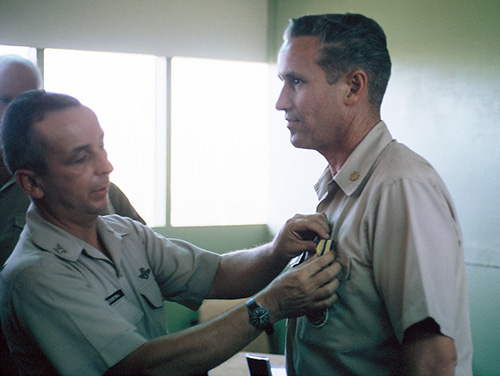 21. Đà Nẵng AB, Tent City: Major R is presented the Air Force Commedation Medal. 1966.