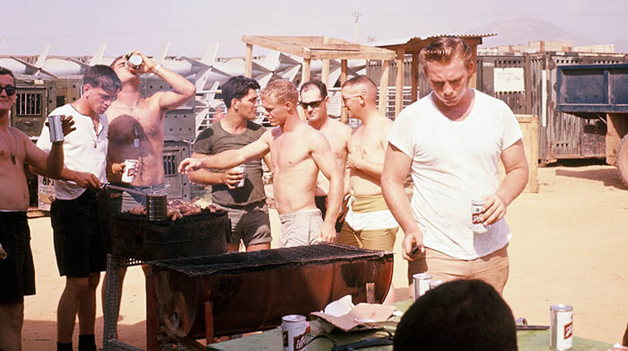 5. Đà Nẵng, K-9 Growl Pad: Tom Baker (right) using K-bar to slice steaks. 1965-1966.