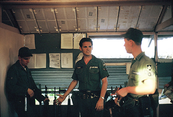 4. Đà Nẵng AB, K-9 Growl Pad: Inside the GP Office. Bulletin Board for SOPs and info. Don Poss (center). 1965.