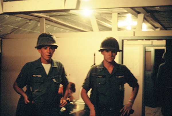 5. Đà Nẵng AB, K-9 Growl Pad: Inside GP Office. Gary Knutson (left) and Don Poss (right) waiting for Guardmount. 1965.
