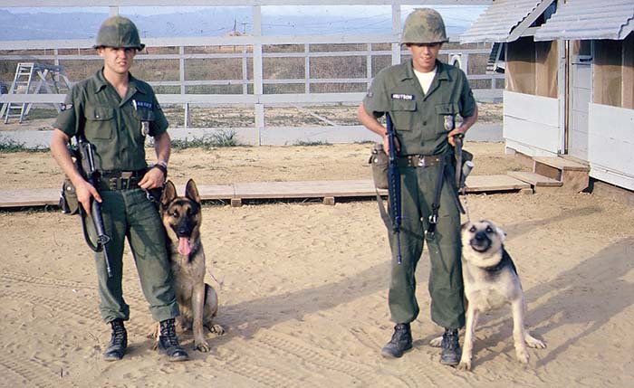 12. Đà Nẵng AB, K-9 Growl Pad: L/R: Don Poss and Blackie; Gary Knutson and Eric. 1965. Both are VSPA Life Members.