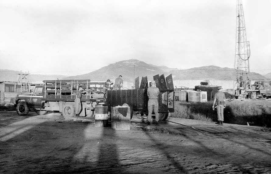 16. Đà Nẵng AB, K-9 Growl Pad: K-9 Trailer being hosed down and cleaned up. 1965.