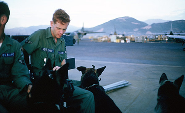 18. Đà Nẵng AB, K-9 Growl Pad: A2C Hemmingway rides to K-9 post in Posting Truck. All K-9 were muzzled for safety. 1965.