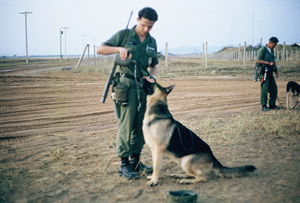 41. Đà Nẵng AB, K-9 Growl Pad: Don Poss pours Blackie some water from his canteen. Blackie liked to pickup my helmet and carry it (what's a little slobber amongst friends?) 1965.