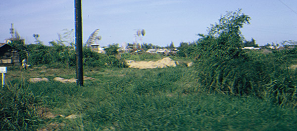 48. Đà Nẵng AB, K-9 Growl Pad: Dawn finally arrives. View from Posting Truck pass another K-9 post. Note radar in the background. 1965.