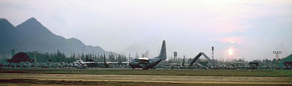 12. Đà Nẵng AB, flight line: Click to see Full Panorama View for C-130 rolling on taxiway (center). 1965.