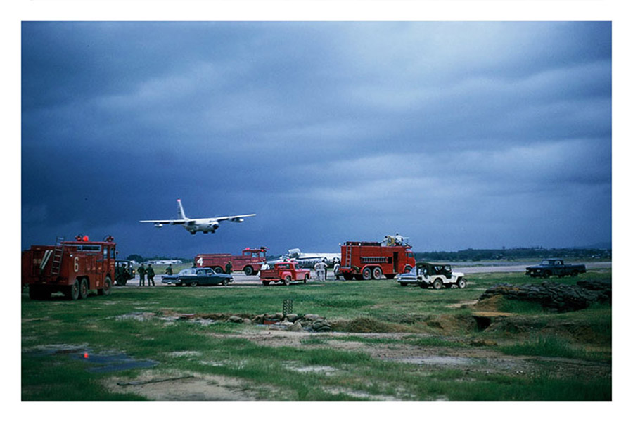 14. Đà Nẵng AB, flight line: C-130 lumbers in for smooth uneventful landing -- Crash Crew ready to roll. 1965.