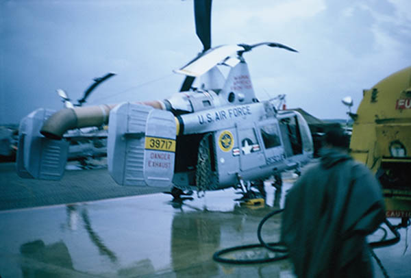 43. Đà Nẵng AB, flight line: Rescue Pedro helicoper parked and refueling. 1965. 