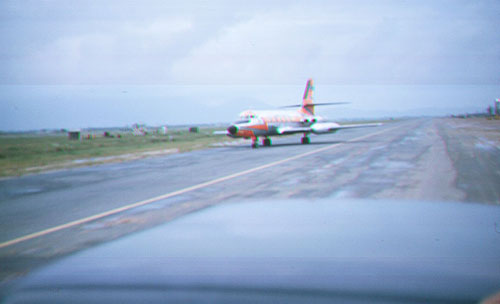 46. Đà Nẵng AB, flight line: VIP aircraft lands and is challenged by AP QRT. 1965.