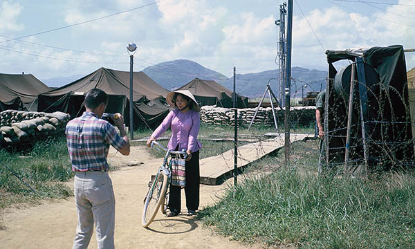 4. Đà Nẵng AB, Tent City: AP Cantonment, Tent City, Access Control post (right). Airman Wallis takes photo of our mamasan. If your still out there I would like to hear from you. 1965.