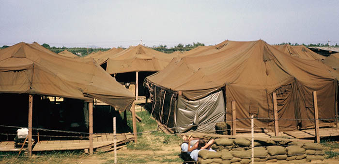 9. Đà Nẵng AB, Tent City: Sweltering tents, too hot to sleep in by 0800. Some guys stretched out ontop of bunkers or found shade wherever. All agreed the heat radiated downward for a tent's top was oppressive and sucked the air out of your lungs. 1965.