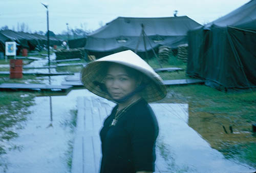 15. Đà Nẵng AB, Tent City: Mamasan was always friendly and a good worker, with a sharp eye out for numb'a ten-thou GIs around her daughtersans. 1965.