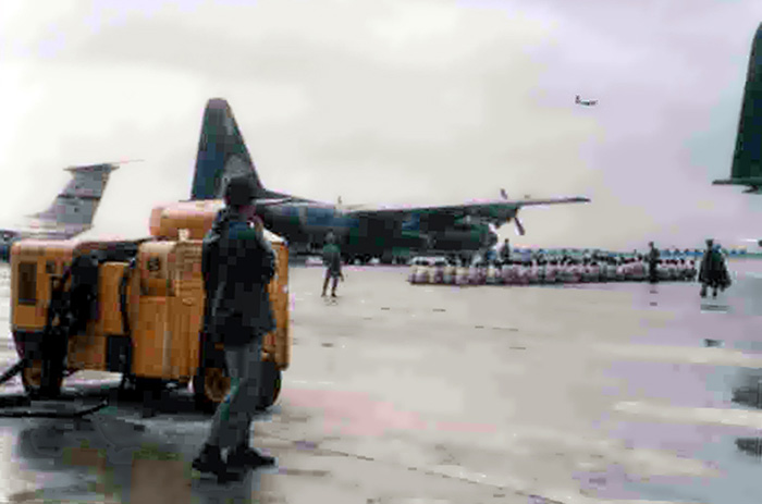 3. Đà Nẵng Air Base: VC POWs set on flight ramp awaiting transportation from Đà Nẵng's POW Camp on a C-130. c1967 Photo by Steen A Lunde, Airlines.net.