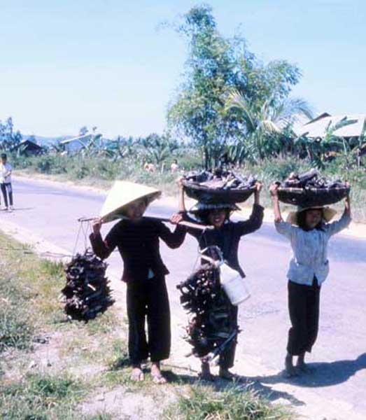 Dai Tan, charcoal girls off to market. MSgt Summerfield: 06