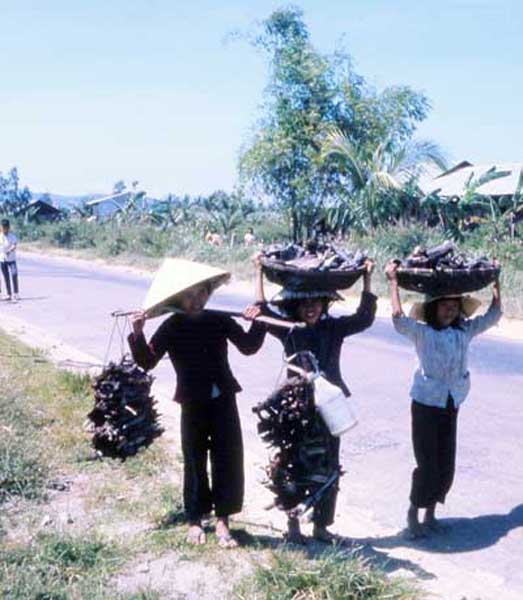 Dai Tan, charcoal girls off to market. MSgt Summerfield: 06