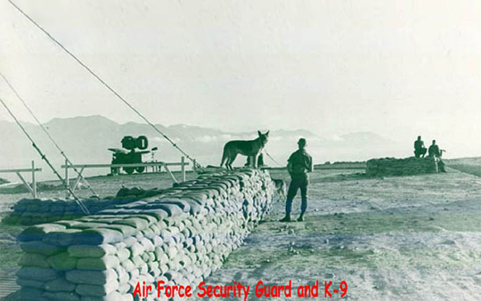 1. Hon Tre Island Portcall Radar, Bunker and Tower support. I took the [K-9] picture in 1967. It is an Air Force Military Policeman and his dog. Early morning shoot. [There appears to be a second Security Police K9 just behind the bunker.] photo © 2008, by Major George E. Martin, USA Retired.