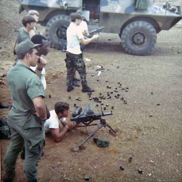 Photo #7 (Nha Trang): Another shot while at the firing range. The AP on the M60 is unknown. Standing is SSgt Roger Rude, NCOIC of the Armory.
