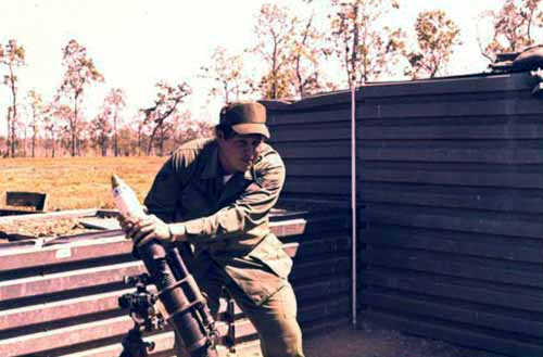 4. Korat RTAFB: Sgt David Worthen, firing mortar. 1972-1973. Photo by: David Worthen, BH, 3rd SPS; KRT, 388th SPS. 1969-70; 1972-73.