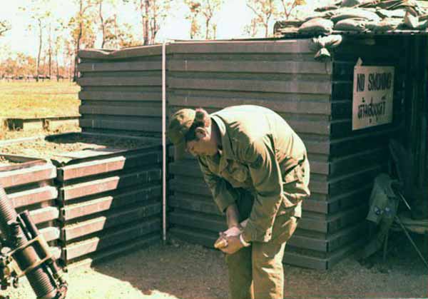 2. Korat RTAFB: Sgt David Worthen, removing mortar pin. 1972-1973. Photo by: David Worthen, BH, 3rd SPS; KRT, 388th SPS. 1969-70; 1972-73.