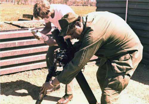 5. Korat RTAFB: Sgt David Worthen and Sgt Hicks, aiming gun. 1972-1973. Photo by: David Worthen, BH, 3rd SPS; KRT, 388th SPS. 1969-70; 1972-73.