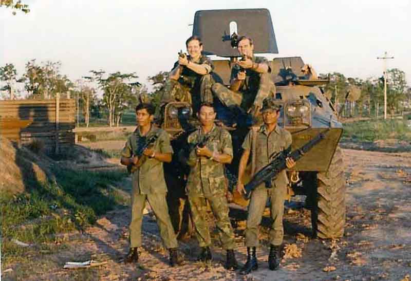3. NKP RTAFB, V100: Sgt Green (top left), Sgt Vasquez (top right), and three four Thai Guards (front). 1973.Photo by: Curtis Hammond, NKP, 56th SPS, QRT Heavy weapons, 1973-1974.