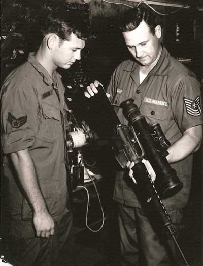 8. MSgt Smith (right) demonstrates an M16 with Starlite Scope. USAF Photo via Don Bishop 1969-1970.
