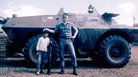 5. Pleiku AB, V100. Larry Sutherland, with boy. Photo by: Clifton Larry Sutherland (RIP), PR, 822nd CSPS, 1968-1969.