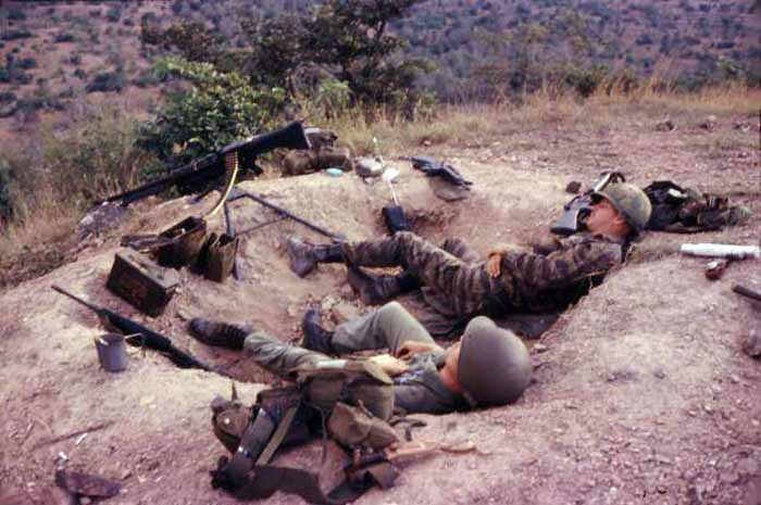 10. Phan Rang Air Base: Operation Nui Dat. Sprawled out and taking a break a little break in the warm sunshine because, believe it or not, it got cold sometime up there on the hill at night, especially if it was raining and the wind blowing. 1966. Photo by: Newell Swartz, LM 262, PR, 35th SPS; PC, 37th SPS, 1966-1967.