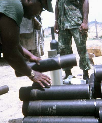 2. Phan Rang Air Base: HW, preparing Bazooka Rounds (Yes, it's the old steel bazooka!). 1970. Photos by: Joe Taragowski, PR, 35th SPS, 1970.