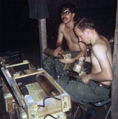 3. Phan Rang Air Base: Frank Kowalski (left) and Rich Palmer (right) pack mortars. 1970. Photo by: Joe Taragowski, PR, 35th SPS, 1970.