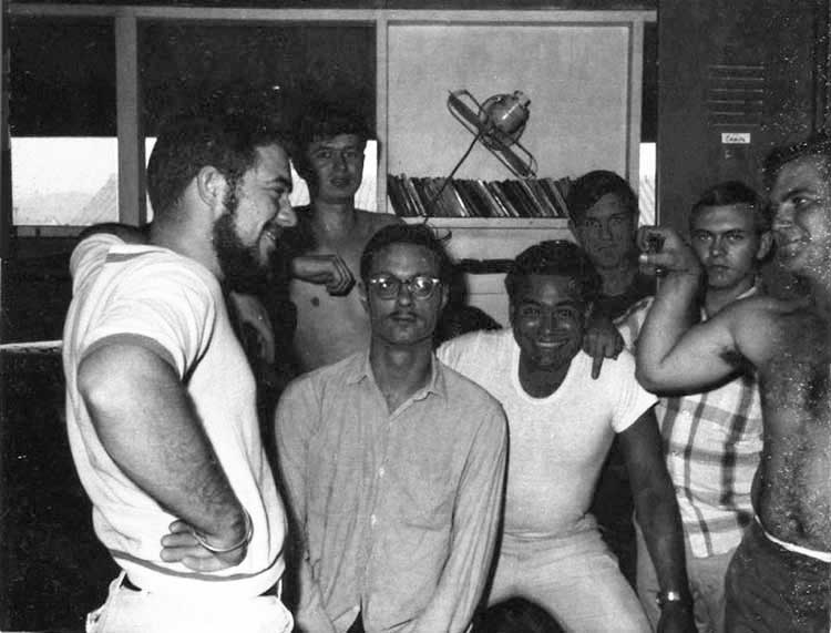 9. Nui Dat: 35th SPS tent-huts 1967. Seems that group pictures occassionally had someone flipping the bird. In this case, the guy in the pladd shirt is yours truly, Stan Reeves. Photo by Stan Reeves, ND 1967.