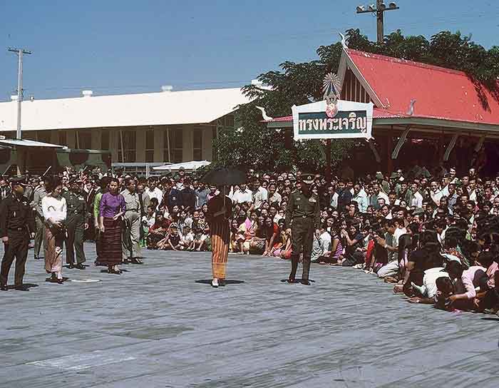 19. NKP RTAFB: Royal Thai King acknowledges subjects as entourage follows.