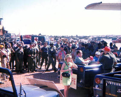 Bob Hope getting into escort Jeep. 1968