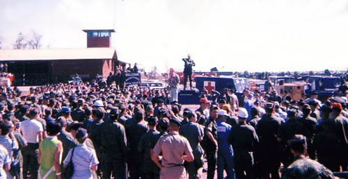 Bob Hope (center) on parking ramp NKP, 1968