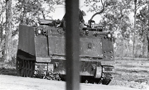 14. NKP RTAFB: APC returning from night shift.  Photo by Wilfred Wright. 1971.