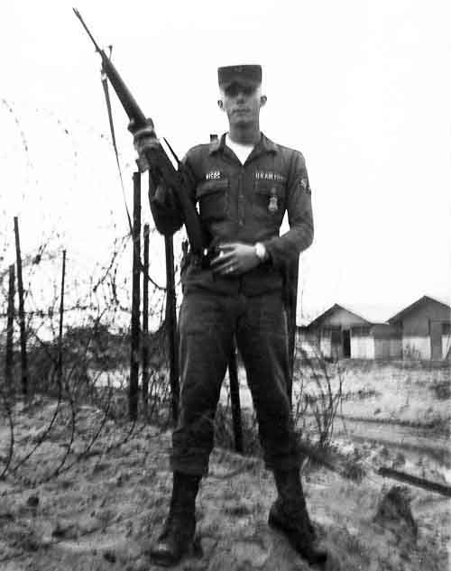 Photo #13 (Nha Trang): This is a shot of me in my cube in the new barracks. I often thought about sending this photo to Hills Bros Coffee for an ad but never did.