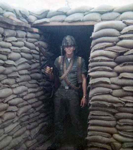 Photo #13 (Nha Trang): This is a shot of me in my cube in the new barracks. I often thought about sending this photo to Hills Bros Coffee for an ad but never did.