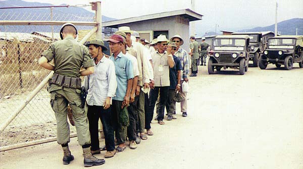13. Nha Trang AB Gate Post-4. Civilian workers being screened. Photo by: Tony Niemotka, LM 577, NT, 14th SPS, 1968-1969.
