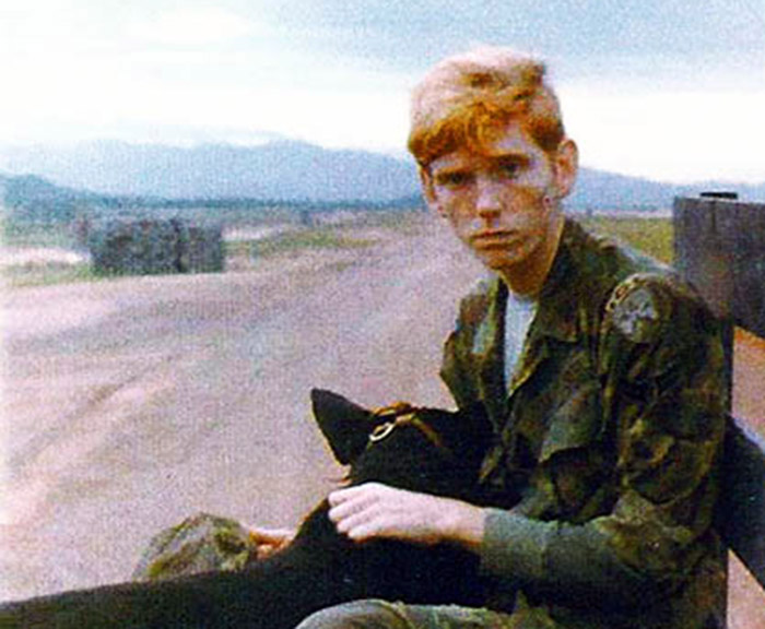 [VSPA has well over 10,000 photos posted at this website. Subjectively, I have long considered this single photo of William M. (Mike) Adcock and Tiny A653 as the most most outstanding representative photo portraying exhaustion and weariness,
as experienced by USAF Air/Security Police in Thailand and Vietnam during the Vietnam War.
Don Poss, VSPA / War-Stories.com Webmaster]
