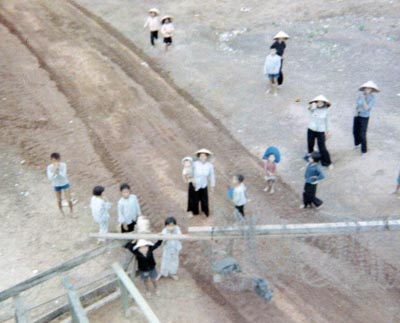 11. Phu Cat AB, Perimeter Tower. View from a Gate Tower. Civilian Vietnamese workers outside gate. Photo by: David Hayes, LM 462, CRB, 12th SPS; PC, 37th APS, 1967-1968.