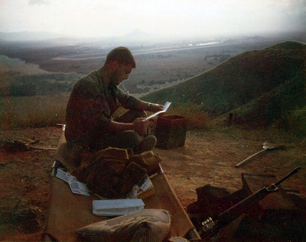 9. Phu Cat Air Base: Post 151, Doug Davis with mail, after chopper. Photo by: Doug D. Davis, 1968.