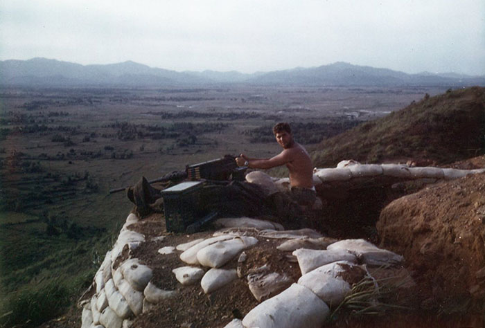 12. Phu Cat Air Base: Post 151, Doug Davis with .50 Cal, in the afternoon. Photo by: Doug D. Davis, 1968.