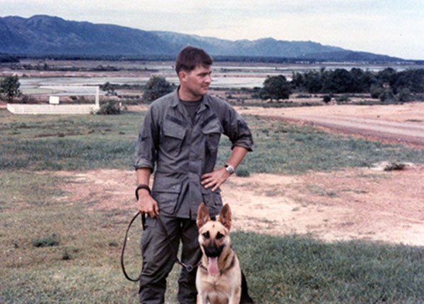 25. Phu Cat Air Base: Doug Davis and K-9 Smoke. Photo by: Doug D. Davis, 1968.