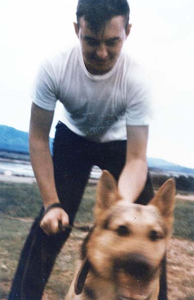 33. Phu Cat Air Base: Gulick with K-9. Photo by: Doug D. Davis, 1968.