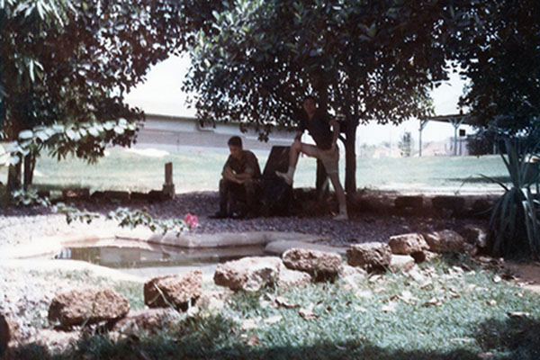59. Phu Cat Air Base: Murry and Gulick take a break at the Texas Pond. Photo by: Doug D. Davis, 1968.