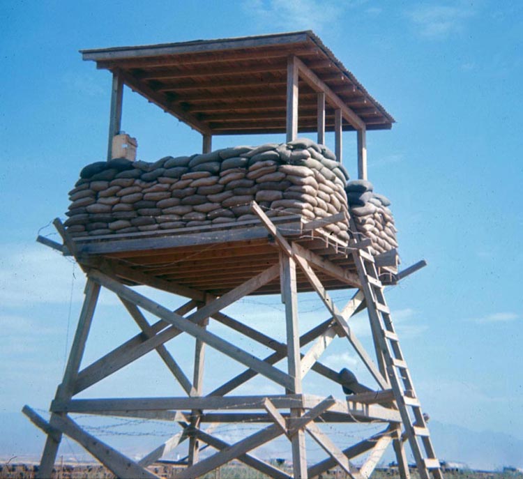 7. Phan Rang Air Base: OP-1 Tower Bunker, overlooks sprawling fields of tall grass and perimeters, armed with an M60 machinegun (There was no 50 cal. on OP1. OP2 had the only 50 cal. during my time.)