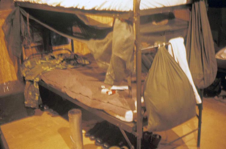 11. Phan Rang Air Base: 366th Air Police tent bunk bed. Mosquito nets at the ready. Aligned boots' stateside-spit-shine melting in sauna heat.